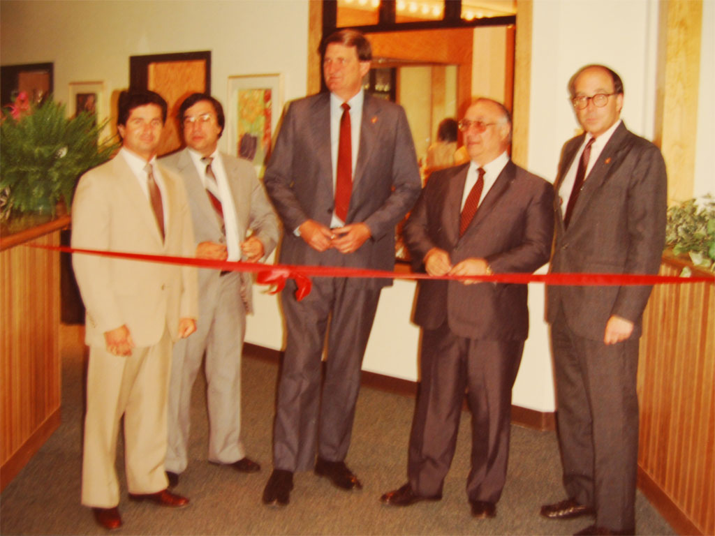 The Cutillo family celebrates with a ribbon cutting ceremony